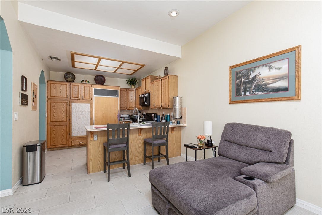2882 Bridgepointe Drive, Las Vegas, NV 89121 Clean tile floors flow from the relaxed seating area directly into the functional kitchen.