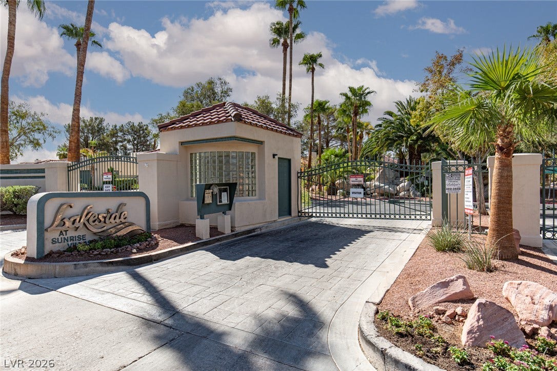 2882 Bridgepointe Drive, Las Vegas, NV 89121 Gated entry welcomes you home to this private community framed by palm trees.