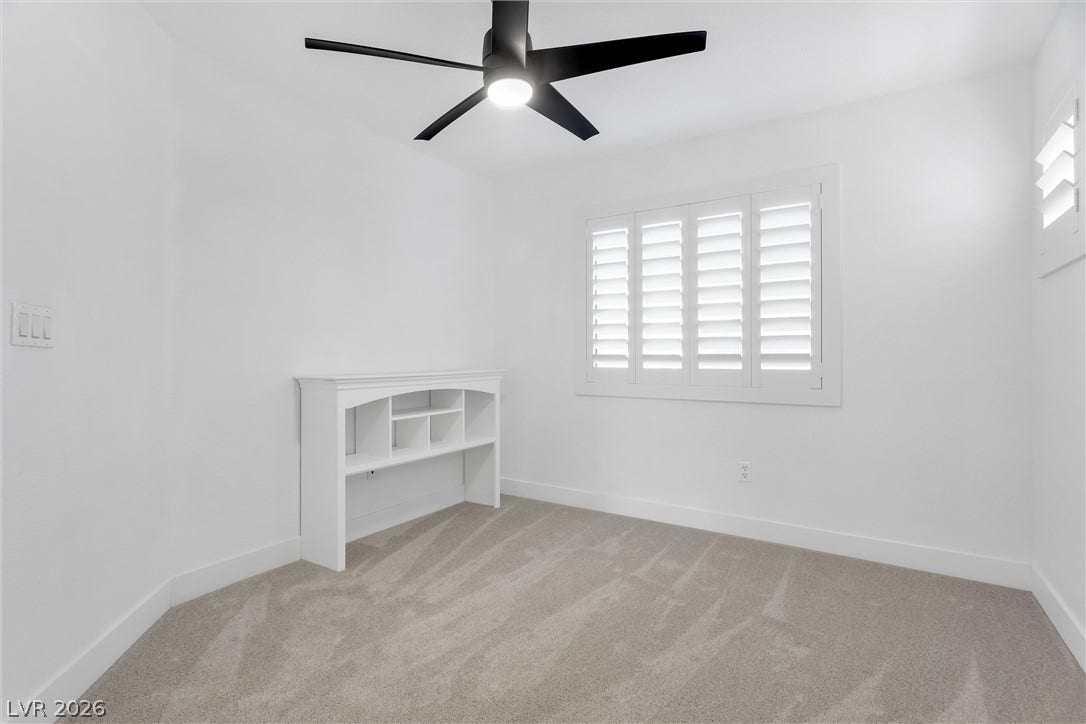 337 Teal Ridge Hills Drive, Henderson, NV 89014 Soft carpeting pairs with pristine walls and plantation shutters in this versatile secondary bedroom.