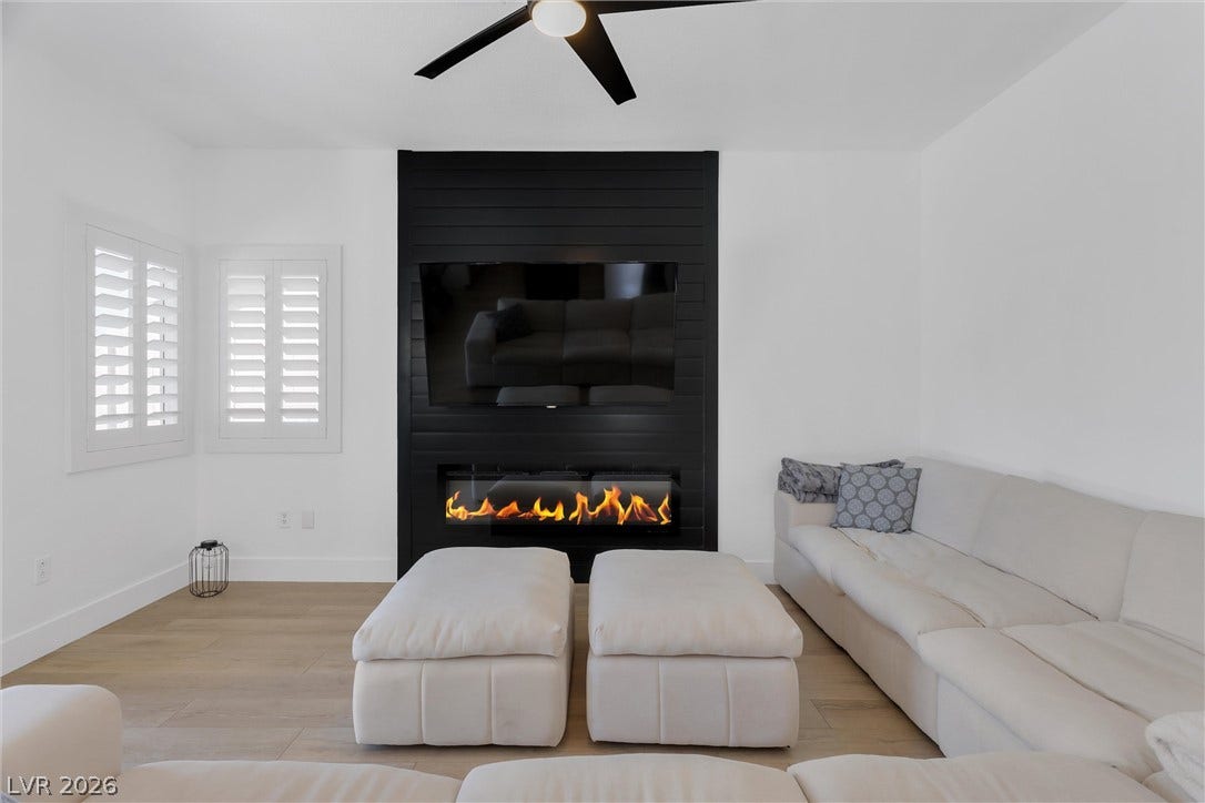 337 Teal Ridge Hills Drive, Henderson, NV 89014 Clean lines and a striking modern fireplace create an inviting, contemporary atmosphere.