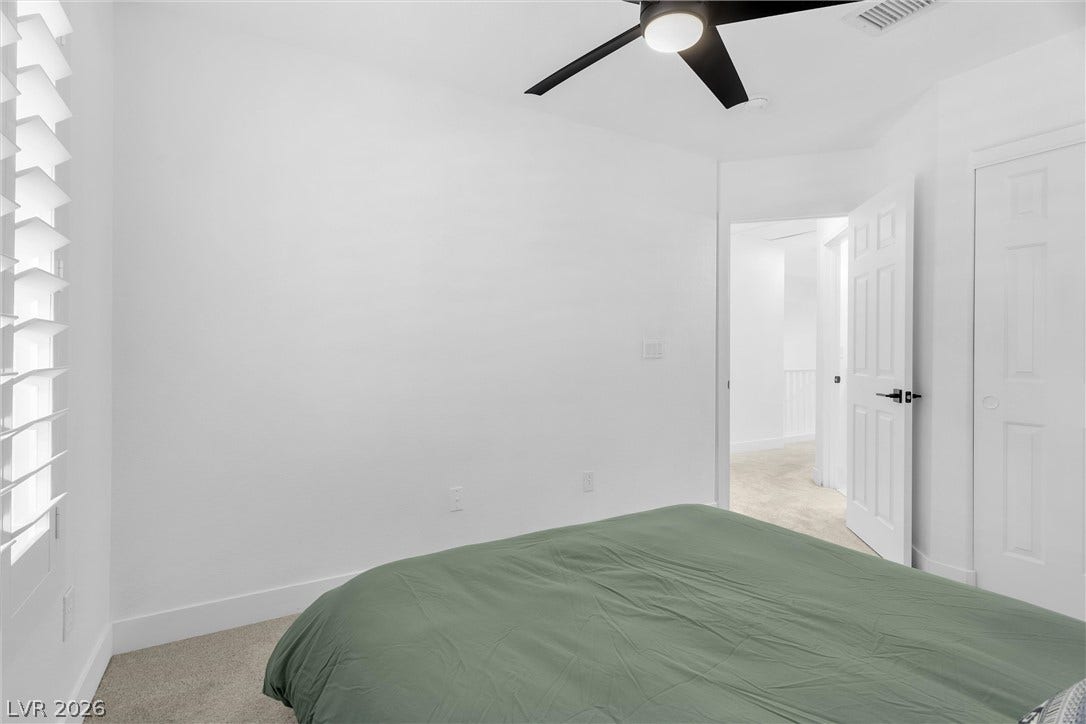 337 Teal Ridge Hills Drive, Henderson, NV 89014 Neutral walls and soft carpeting create a serene and restful atmosphere in this bedroom.