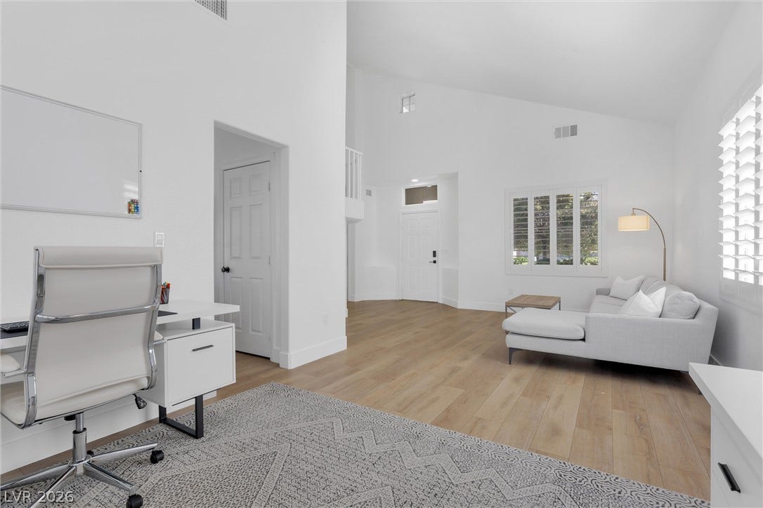 337 Teal Ridge Hills Drive, Henderson, NV 89014 Soaring vaulted ceilings and wood floors define this airy living space.