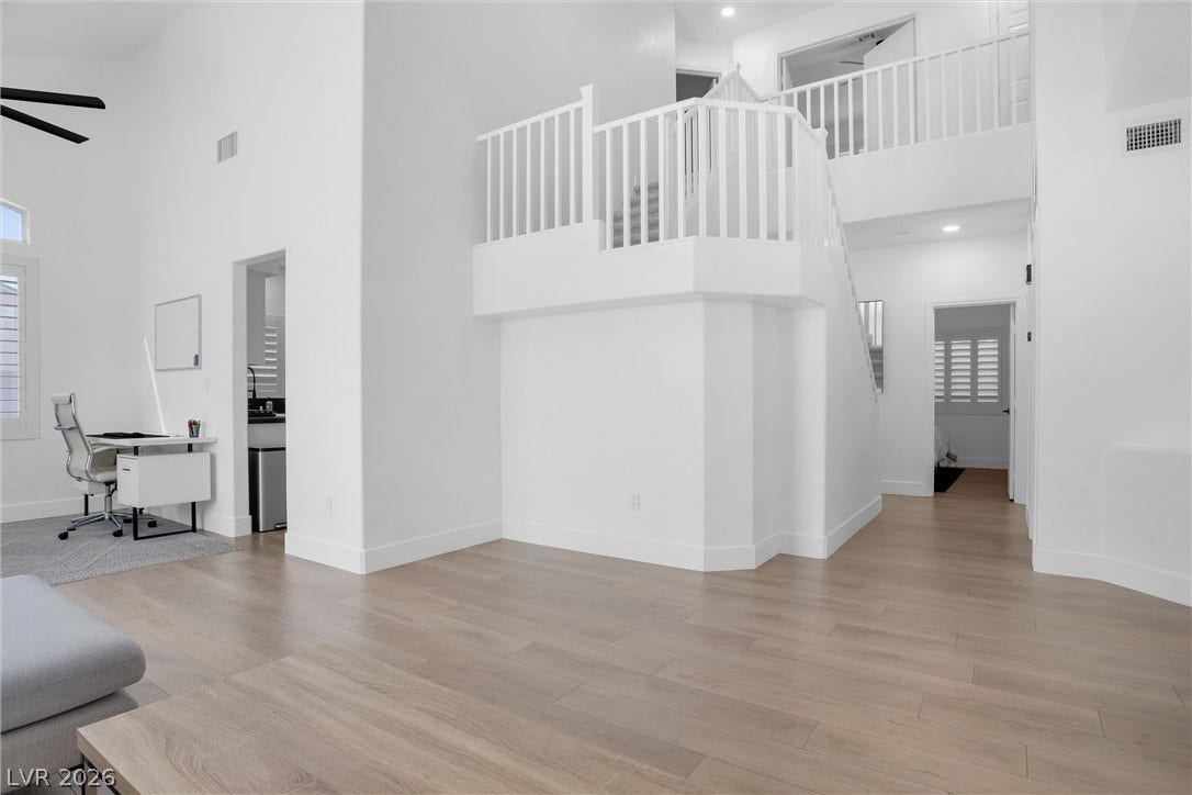 337 Teal Ridge Hills Drive, Henderson, NV 89014 Clean lines and warm wood floors define this soaring, multi-level living environment.