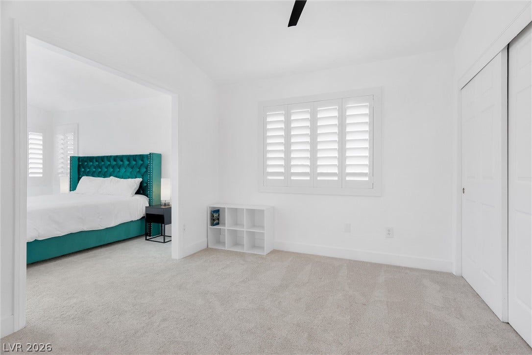 337 Teal Ridge Hills Drive, Henderson, NV 89014 Plush carpeting and custom plantation shutters accent this versatile secondary bedroom suite.