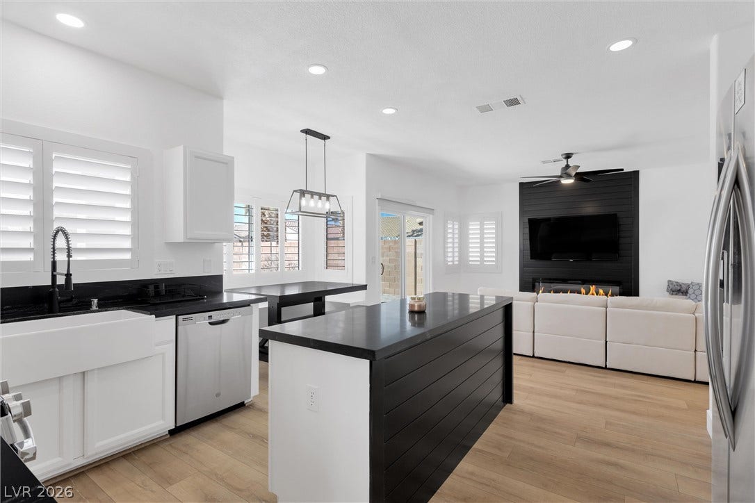 337 Teal Ridge Hills Drive, Henderson, NV 89014 An open floor plan seamlessly connects the modern culinary workspace to the light-filled living area.