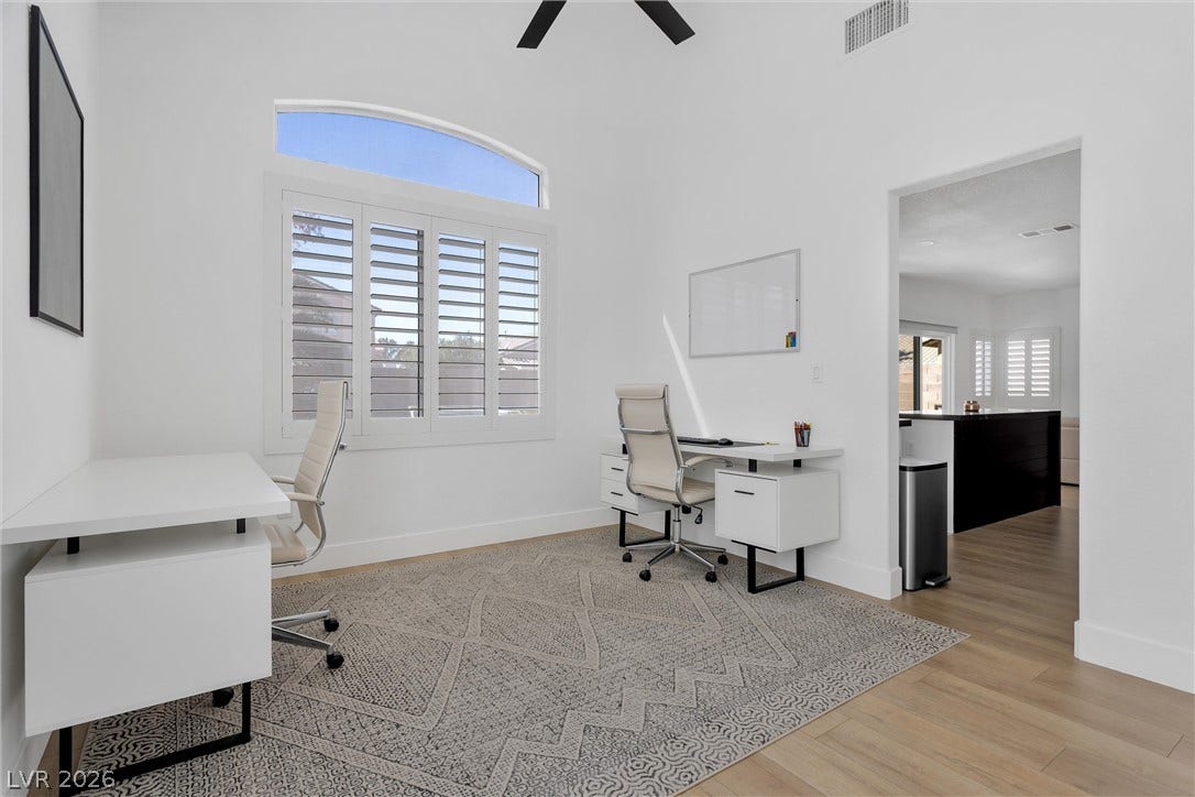 337 Teal Ridge Hills Drive, Henderson, NV 89014 High vaulted ceilings and custom shutters define this versatile dedicated workspace.