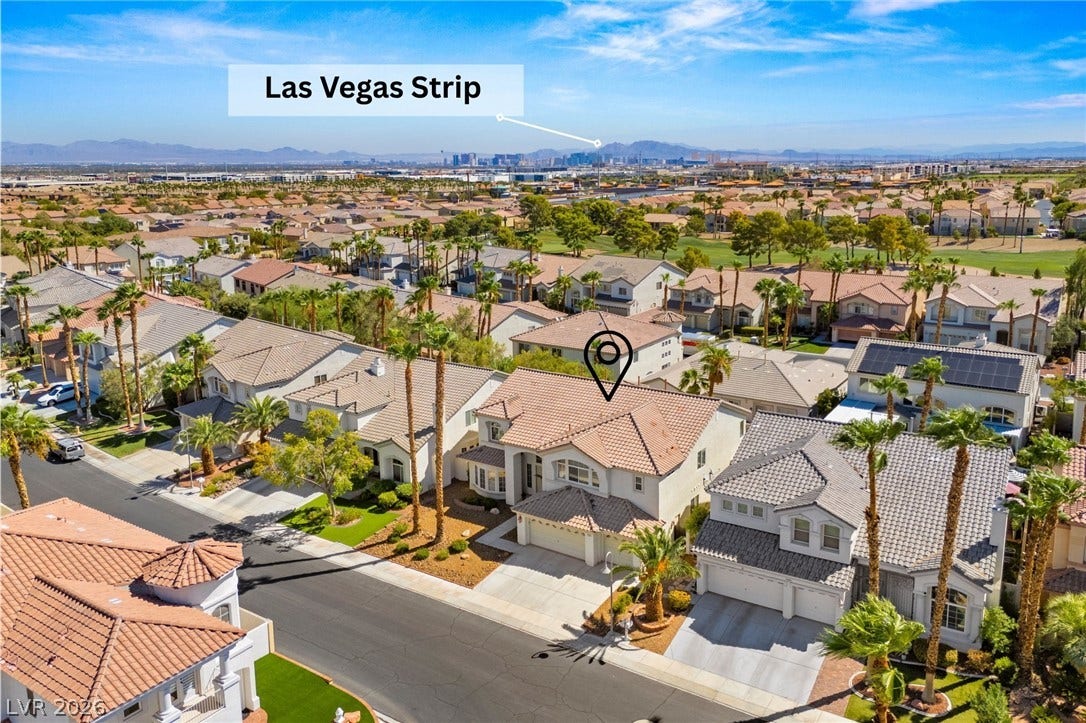 Quiet neighborhood setting offering distant views of the skyline and mountains.