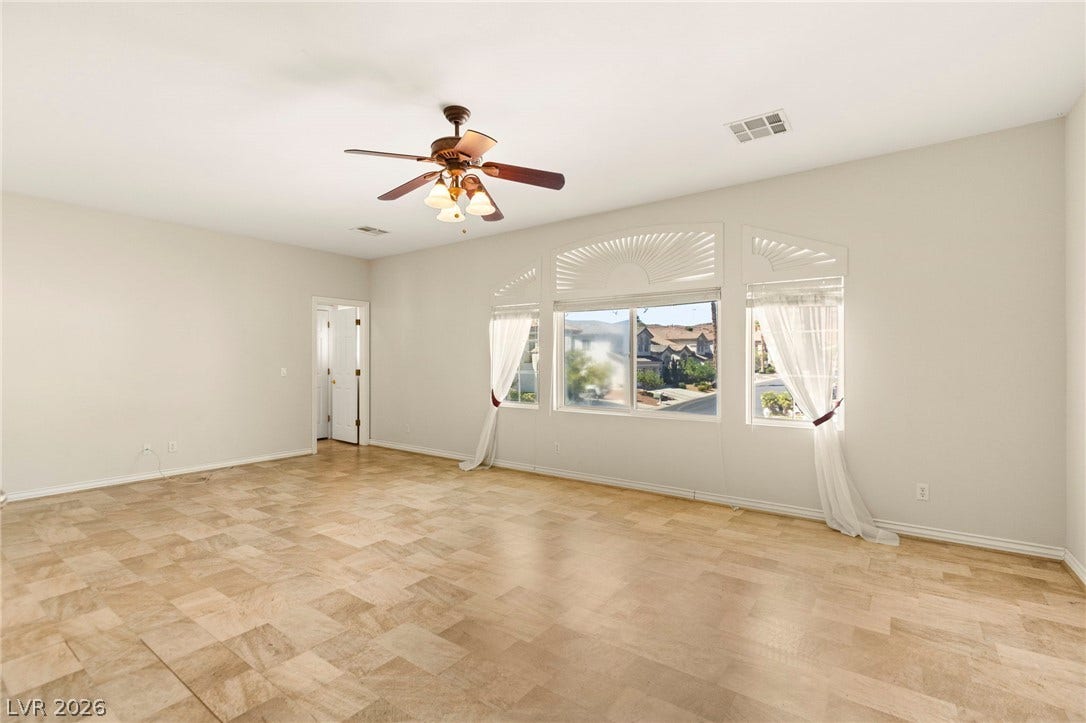 Located on the upper floor, this massive enclosed den is larger than most primary bedrooms, filled with tons of natural light, and features its own wet bar, making it an ideal sixth bedroom.
