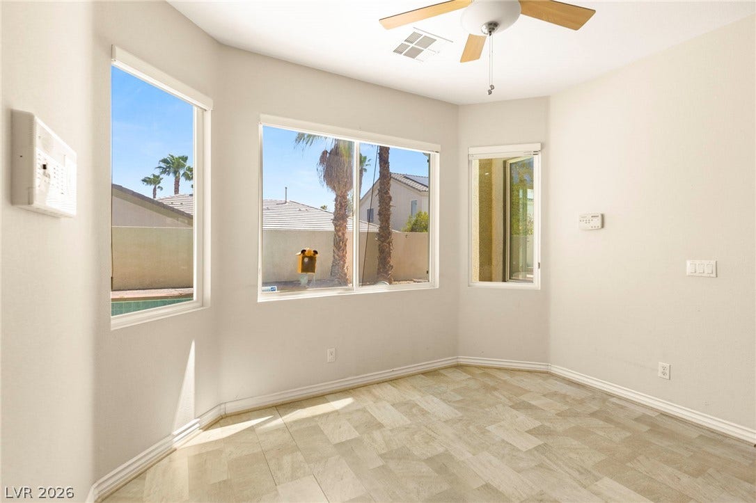 Breakfast nook with multiple side by side windows overlooking backyard oasis.