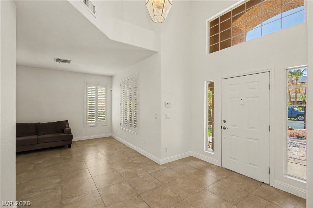1424 Clipperton Avenue, Henderson, NV 89074 High ceilings and clean tile flooring define this airy entryway filled with natural light.