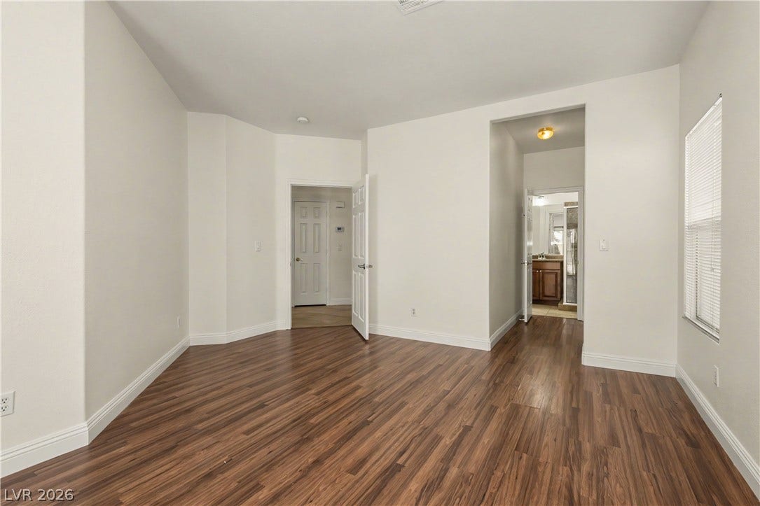 1424 Clipperton Avenue, Henderson, NV 89074 Rich wood floors lay a warm foundation below tall, neutral walls and clean baseboards.