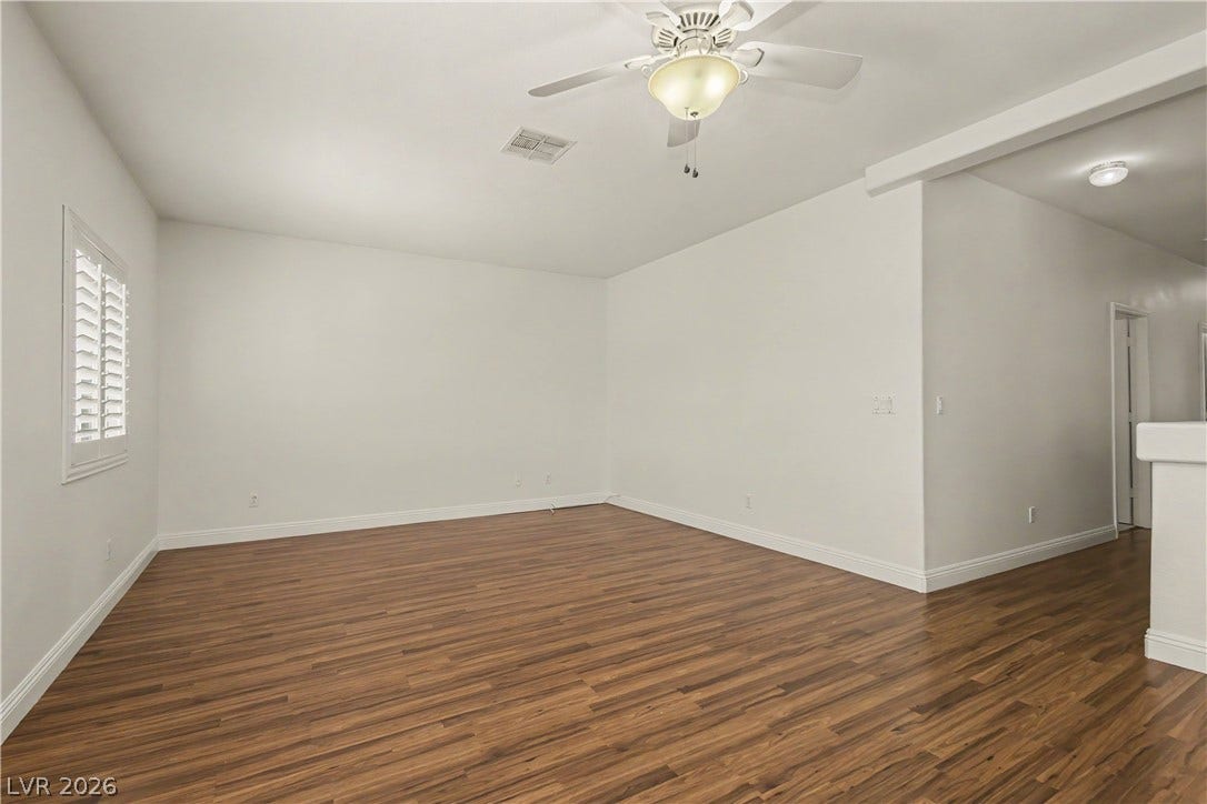 1424 Clipperton Avenue, Henderson, NV 89074 Warm wood flooring and clean walls define this versatile open living space.