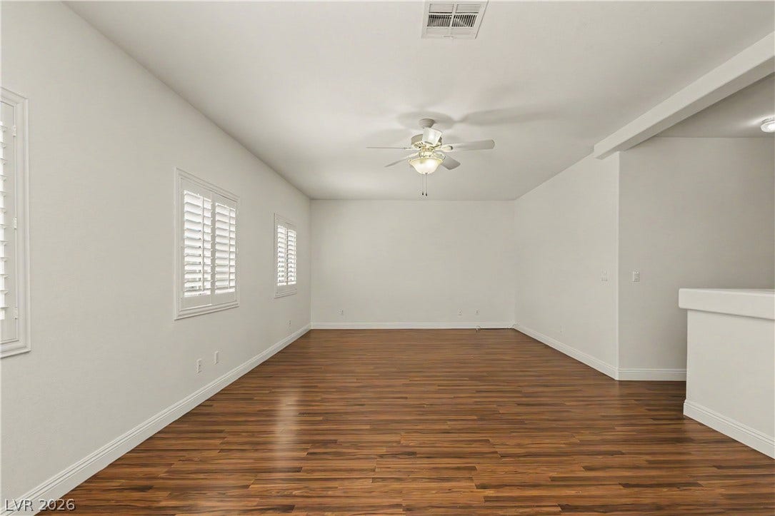 1424 Clipperton Avenue, Henderson, NV 89074 Warm wood flooring and classic window shutters define this versatile, open living area.