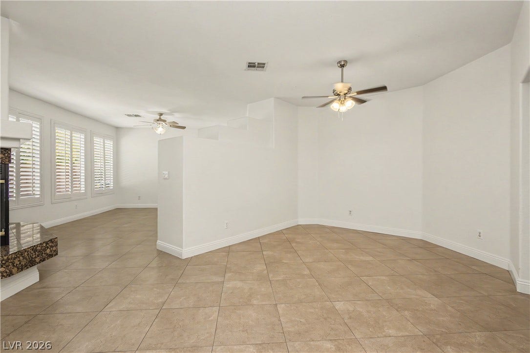 1424 Clipperton Avenue, Henderson, NV 89074 Clean tile flooring and a neutral color palette define this open-concept living space.