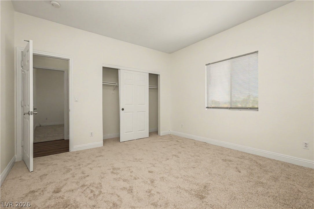 1424 Clipperton Avenue, Henderson, NV 89074 Neutral walls and soft carpeting create a clean foundation in this comfortable bedroom space.