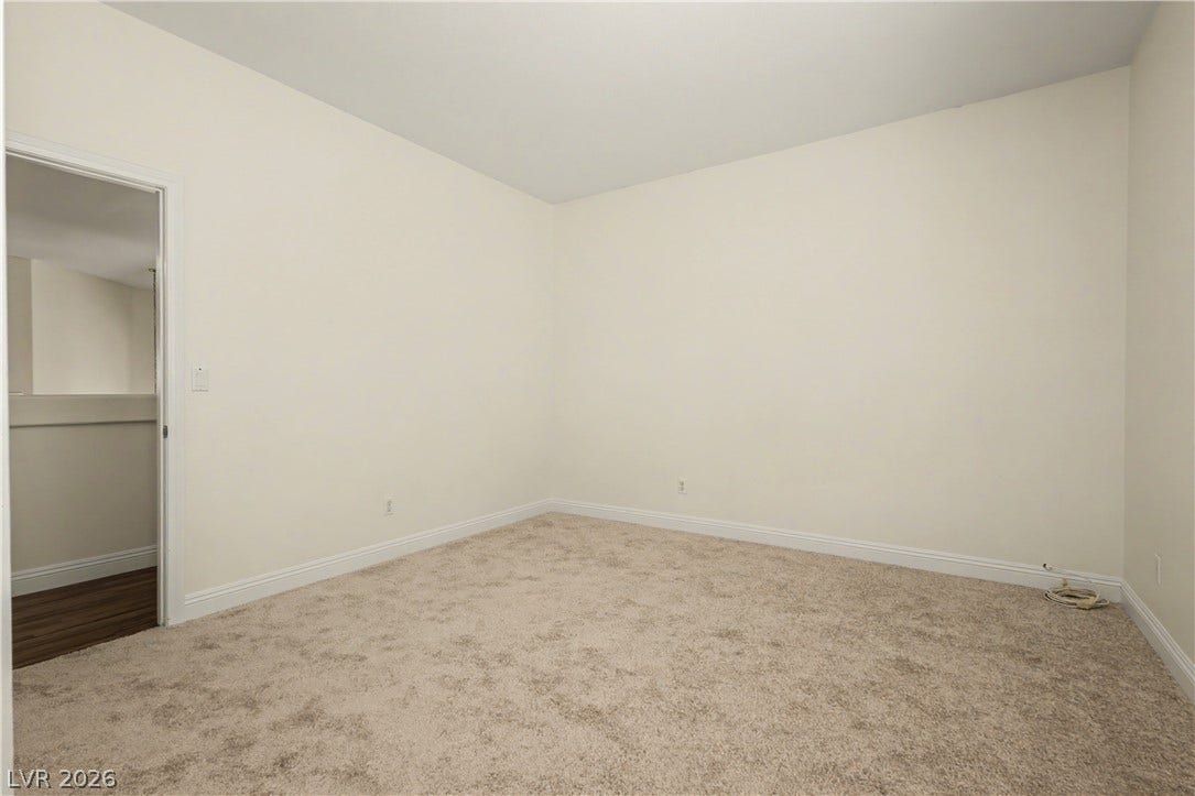 1424 Clipperton Avenue, Henderson, NV 89074 Smooth plaster walls and neutral carpeting define this versatile interior space.