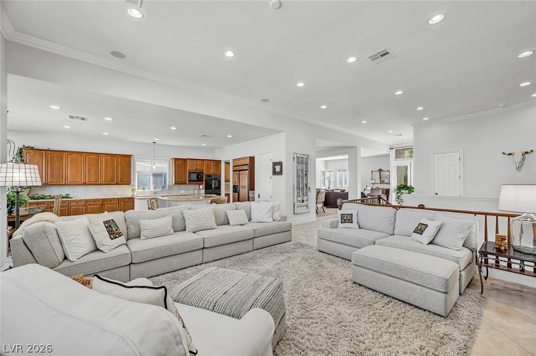 1116 Golden Age Court, Las Vegas, NV 89144 Recessed lighting illuminates this sprawling, open concept space connecting the living room and kitchen.