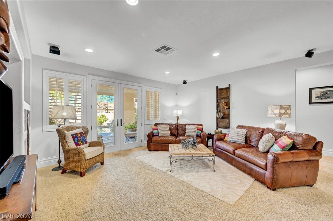 1116 Golden Age Court, Las Vegas, NV 89144 A spacious living area features double glass doors opening to the outdoor patio.