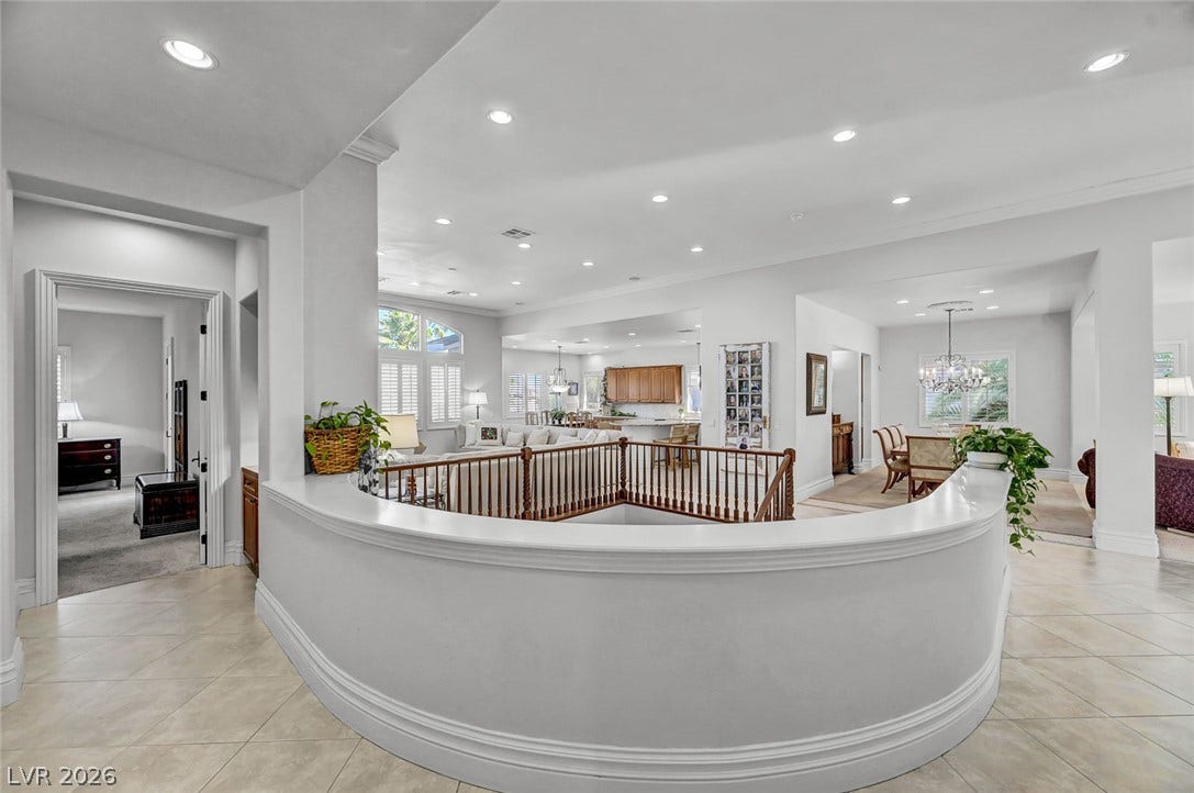 1116 Golden Age Court, Las Vegas, NV 89144 Gleaming tile floors and architectural curves welcome you into this light-filled entry hallway.