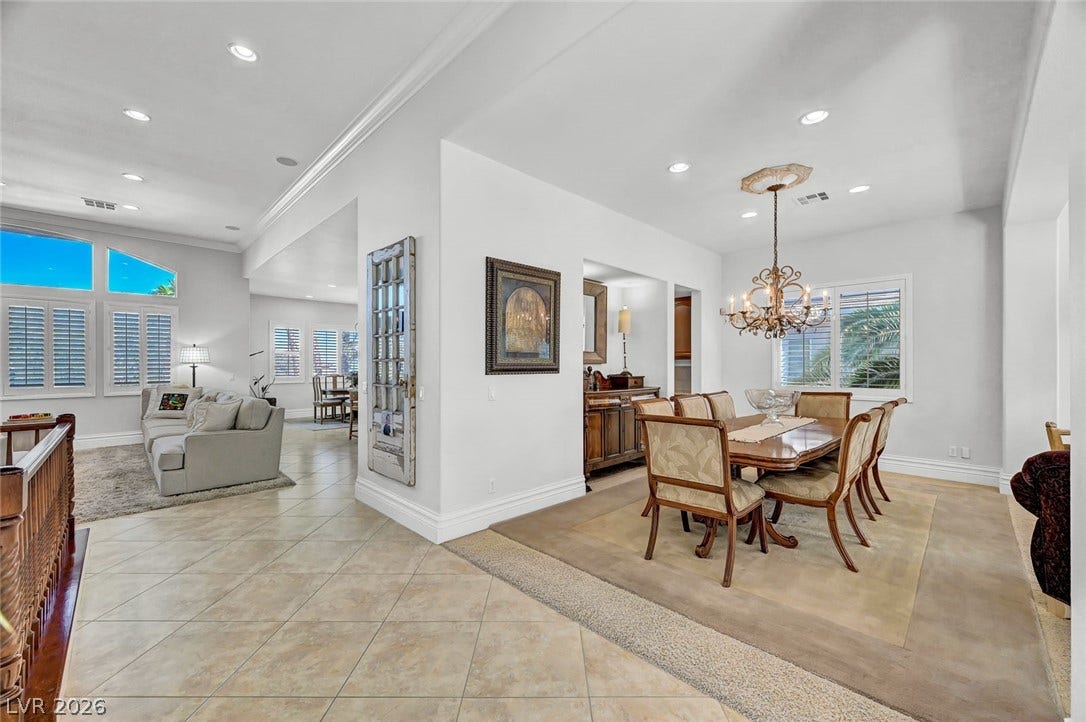 1116 Golden Age Court, Las Vegas, NV 89144 Gleaming beautiful floors and architectural arches connect the formal dining room to open living spaces.