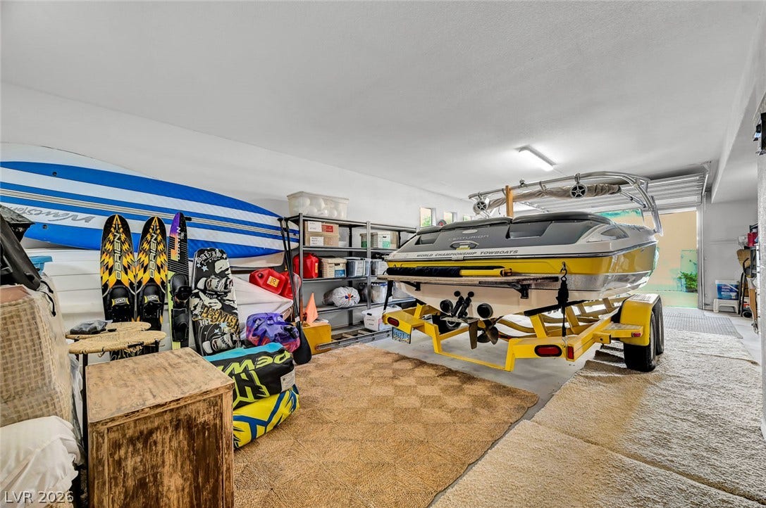 1116 Golden Age Court, Las Vegas, NV 89144 An oversized garage offers ample space for recreational storage and vehicle parking.