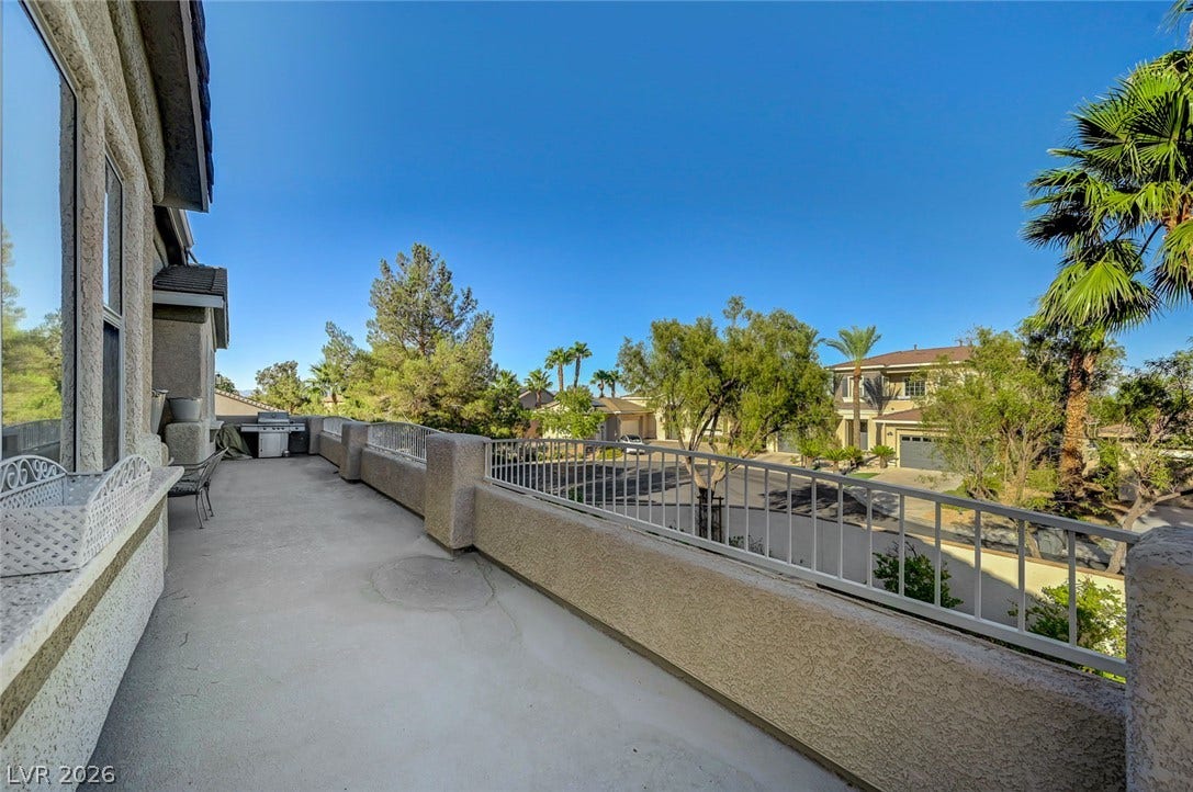 1116 Golden Age Court, Las Vegas, NV 89144 An elevated terrace overlooks neighborhood views under a clear blue sky.