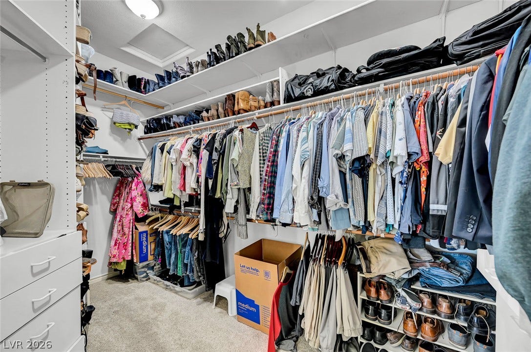 1116 Golden Age Court, Las Vegas, NV 89144 A spacious walk-in closet includes ample shelving, hanging rods, and drawers.