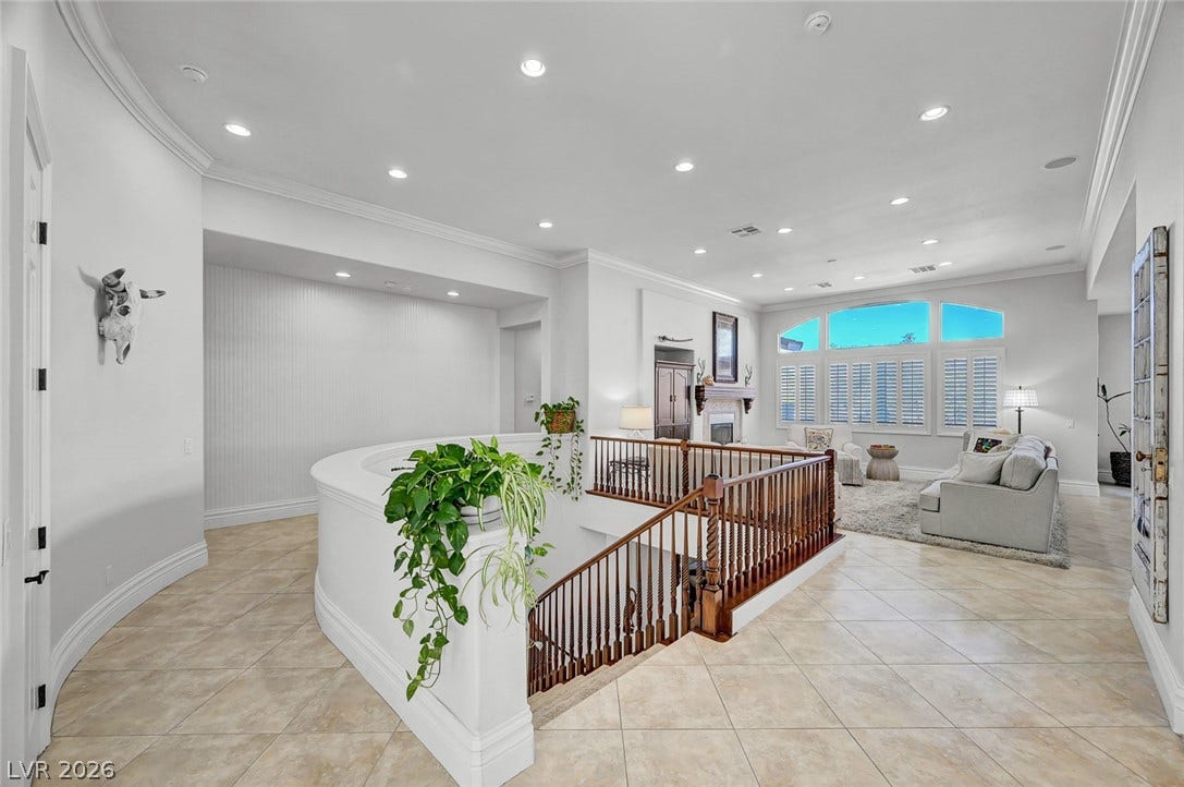 1116 Golden Age Court, Las Vegas, NV 89144 An open landing with tiled flooring connects the upper-level living areas near the staircase.