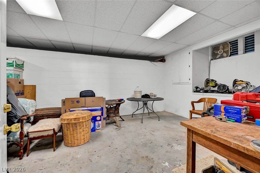 1116 Golden Age Court, Las Vegas, NV 89144 Concrete floors and a drop ceiling define this versatile lower-level custom storage area.