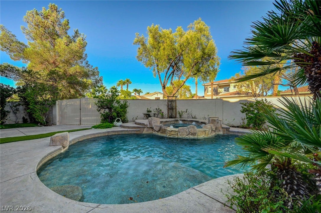 1116 Golden Age Court, Las Vegas, NV 89144 A stone-accented pool and raised spa grace the private, wall-enclosed backyard retreat.