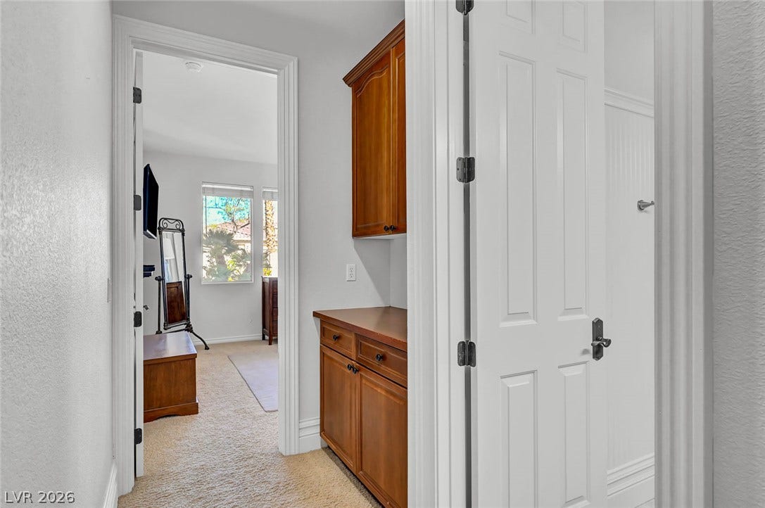 1116 Golden Age Court, Las Vegas, NV 89144 A built-in dresser provides storage along the hallway leading into a bedroom.