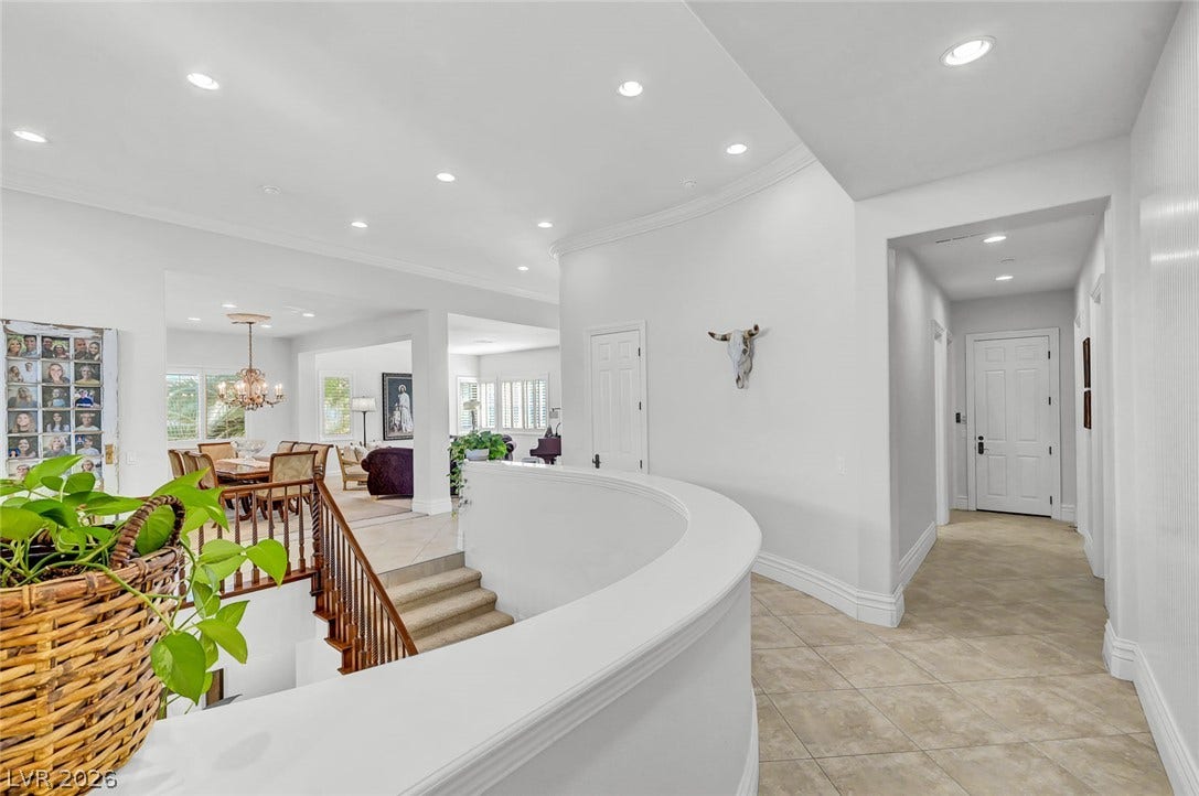1116 Golden Age Court, Las Vegas, NV 89144 Recessed lighting and curved architectural details guide you through a bright, open hallway layout.