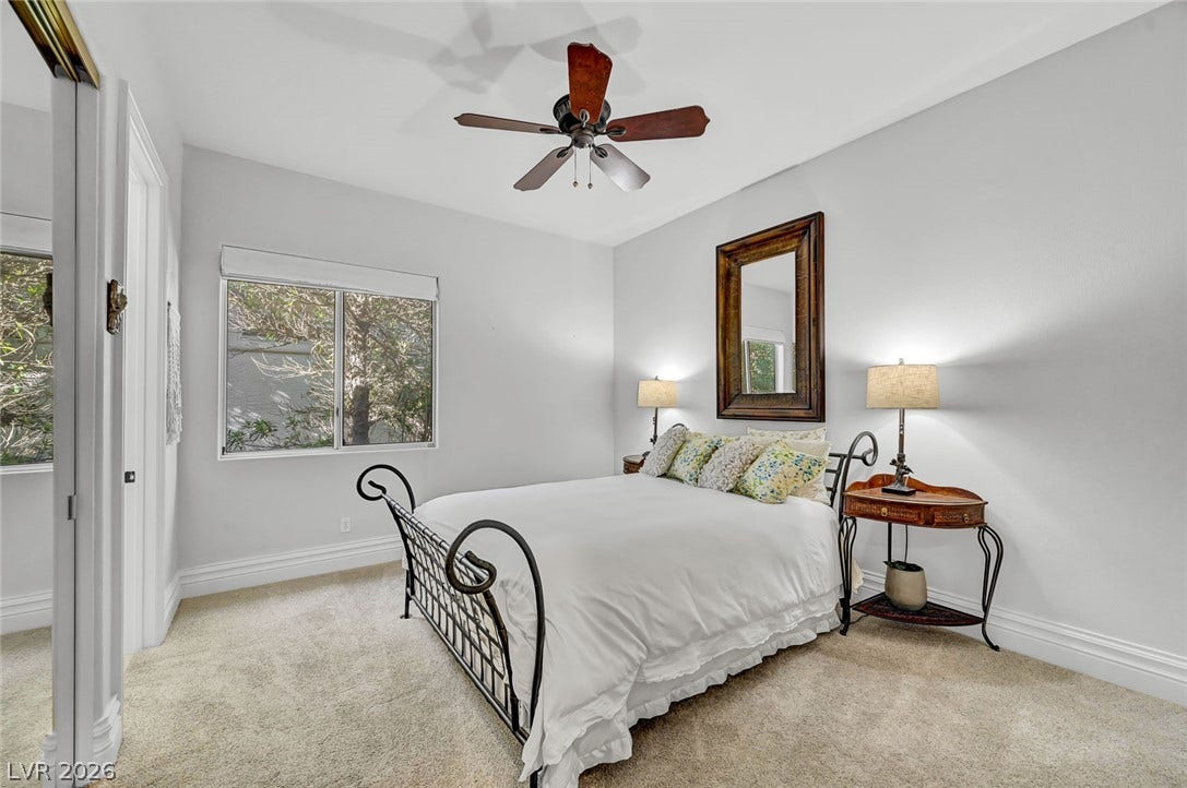 1116 Golden Age Court, Las Vegas, NV 89144 Plush carpeting and crown molding detail this welcoming bedroom retreat.