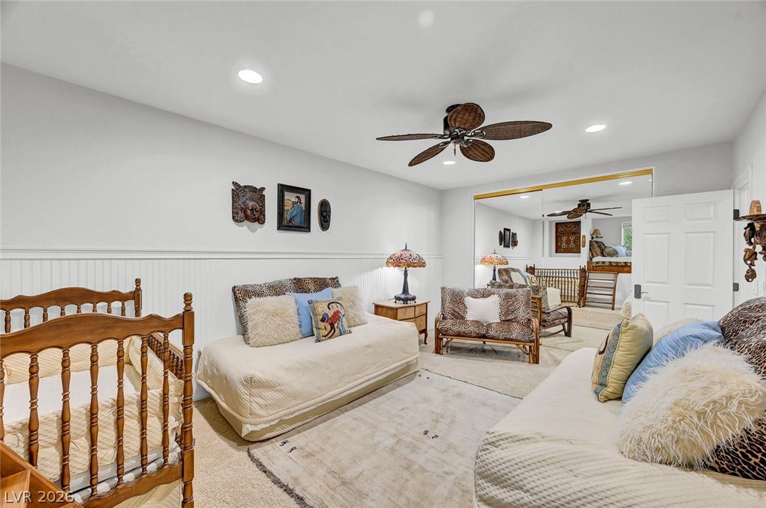 1116 Golden Age Court, Las Vegas, NV 89144 Smooth plaster walls with classic wainscoting details create a serene, neutral backdrop.