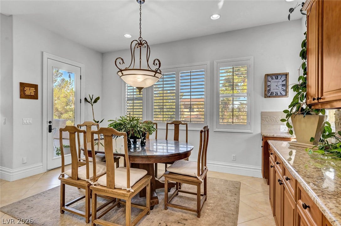 1116 Golden Age Court, Las Vegas, NV 89144 Sunlight streams through plantation shutters into an inviting dining space.
