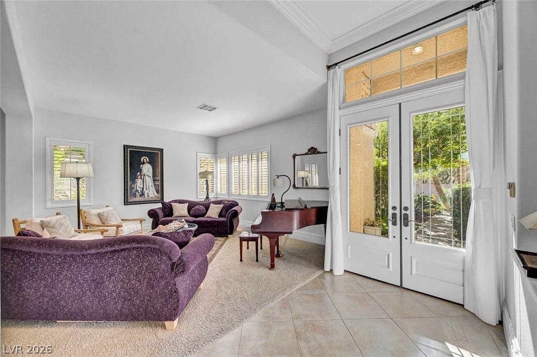 1116 Golden Age Court, Las Vegas, NV 89144 Double doors open to an airy living space with tall ceilings and generous natural light.