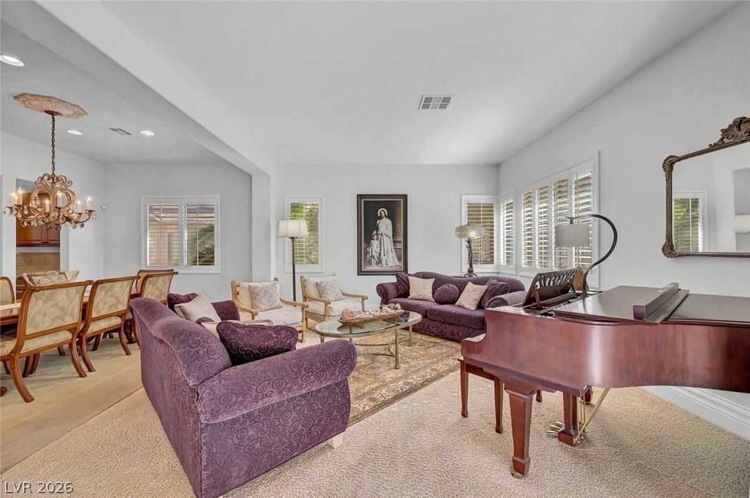 1116 Golden Age Court, Las Vegas, NV 89144 An open floor plan connects the living and dining areas under high ceilings.