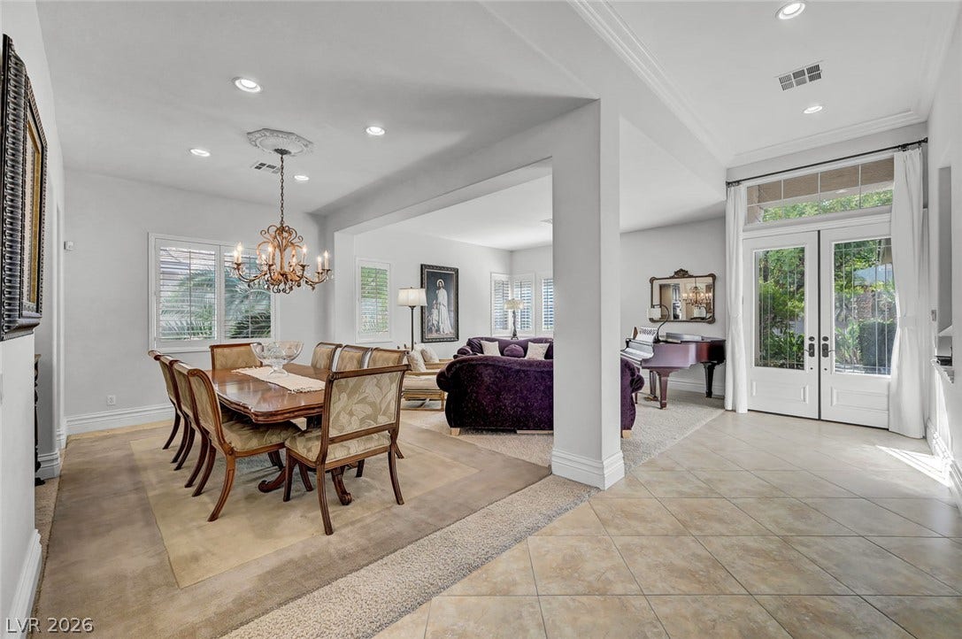 1116 Golden Age Court, Las Vegas, NV 89144 Home transitions into an open-concept dining area with elegant crown molding.