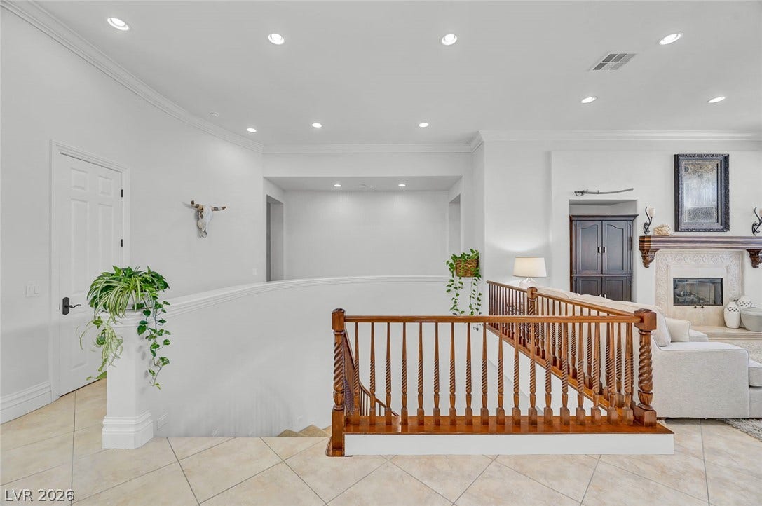 1116 Golden Age Court, Las Vegas, NV 89144 Classic wood railings frame this open upper-level landing.