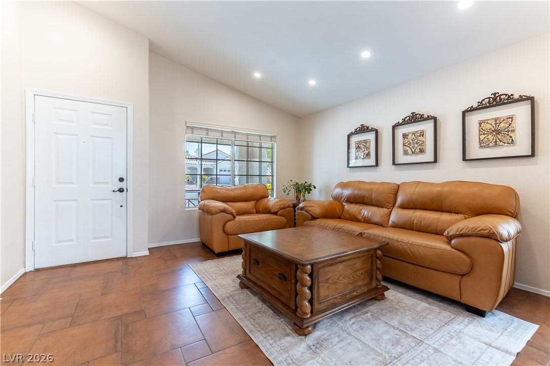 2408 Pebble Springs Court, Henderson, NV 89074 Foyer, Formal Living Room, Vaulted Ceiling, Recessed lighting with dimmers, Timeless Porcelain Tile flooring pinwheel design