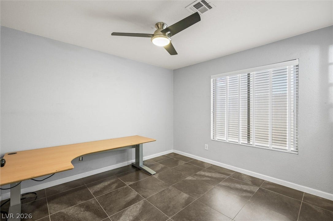 1584 Bozeman Drive, Henderson, NV 89012 Large tile flooring and structured windows create a clean, versatile modern workspace.