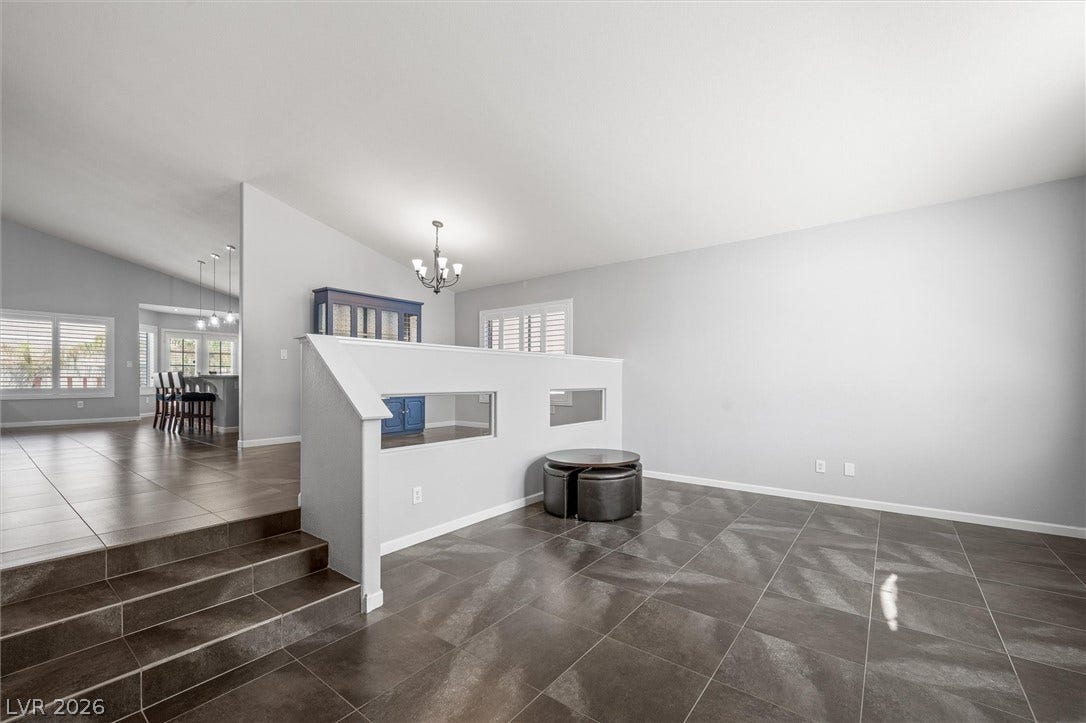 1584 Bozeman Drive, Henderson, NV 89012 Tiled floors and a sunken design create architectural interest in this open living space.