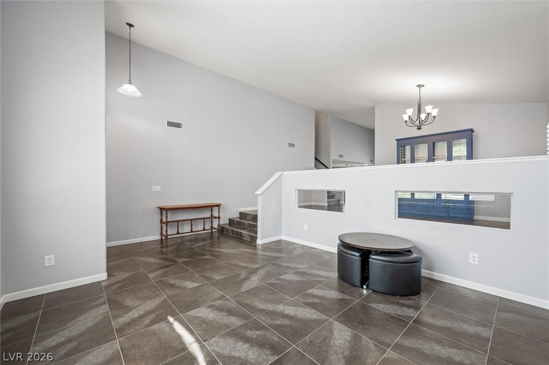 1584 Bozeman Drive, Henderson, NV 89012 Gleaming tile floors and soaring ceilings define this airy, open-concept living space.