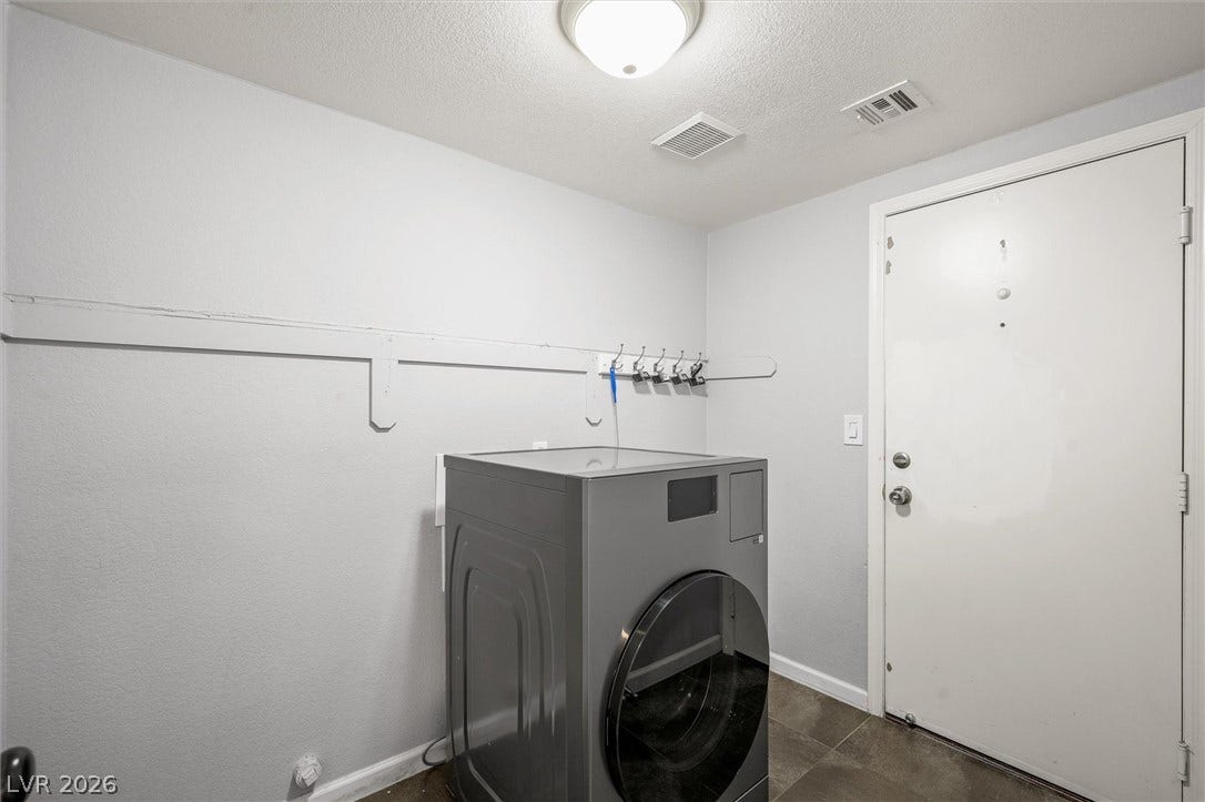 1584 Bozeman Drive, Henderson, NV 89012 Functional utility space features durable tile flooring and access to the exterior.