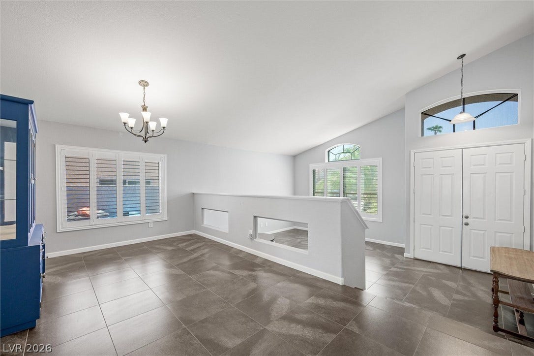 1584 Bozeman Drive, Henderson, NV 89012 A spacious formal entry with vaulted ceilings and elegant tile flooring welcomes visitors inside.
