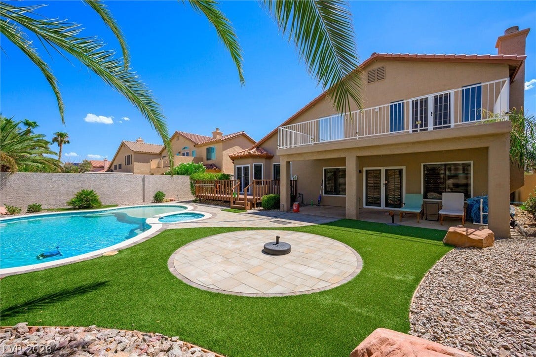1584 Bozeman Drive, Henderson, NV 89012 An inviting backyard oasis features a sparkling pool and a spacious covered patio.