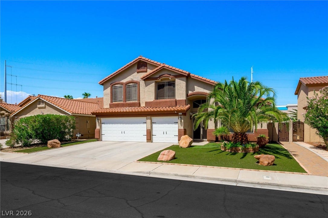 1584 Bozeman Drive, Henderson, NV 89012 Spanish tile roofing and custom stucco finishes define this desert-landscaped suburban residence.