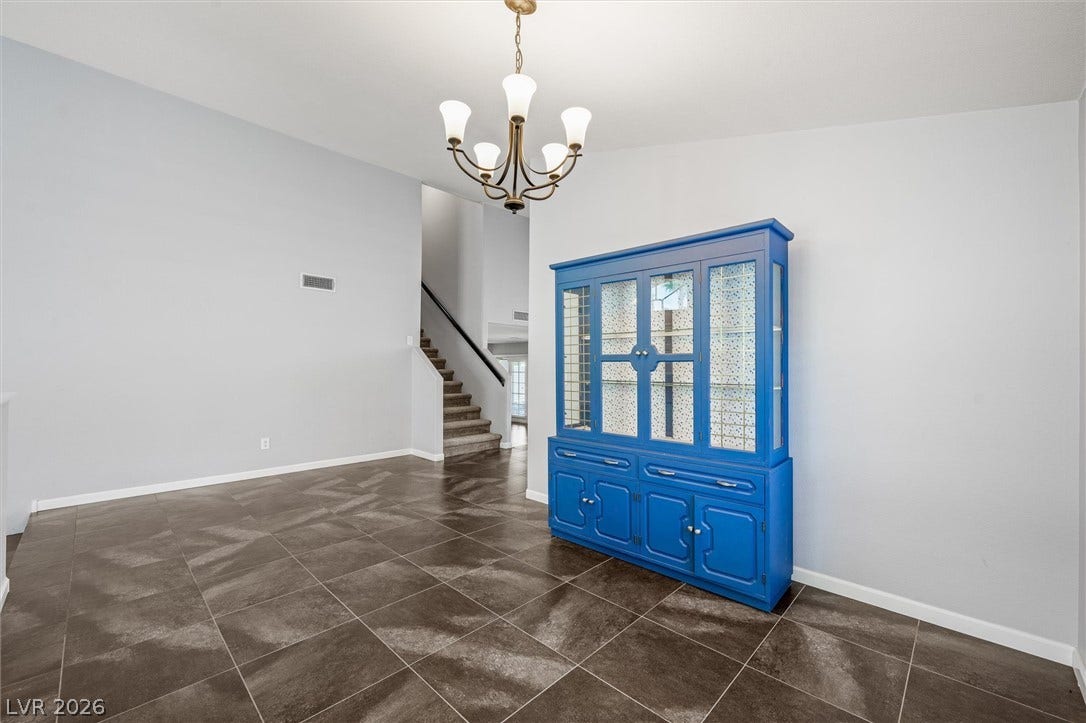 1584 Bozeman Drive, Henderson, NV 89012 High ceilings and large floor tiles create an inviting open transition near the stairs.