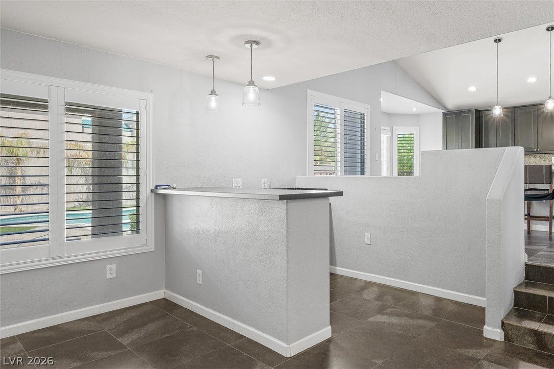 1584 Bozeman Drive, Henderson, NV 89012 Gleaming tile floors and large shuttered windows define this versatile dining or living space.