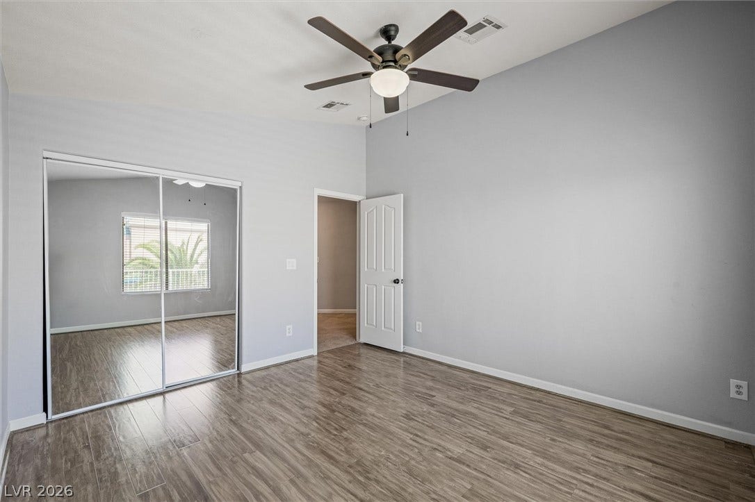 1584 Bozeman Drive, Henderson, NV 89012 High ceilings and wood flooring define this versatile bedroom space.